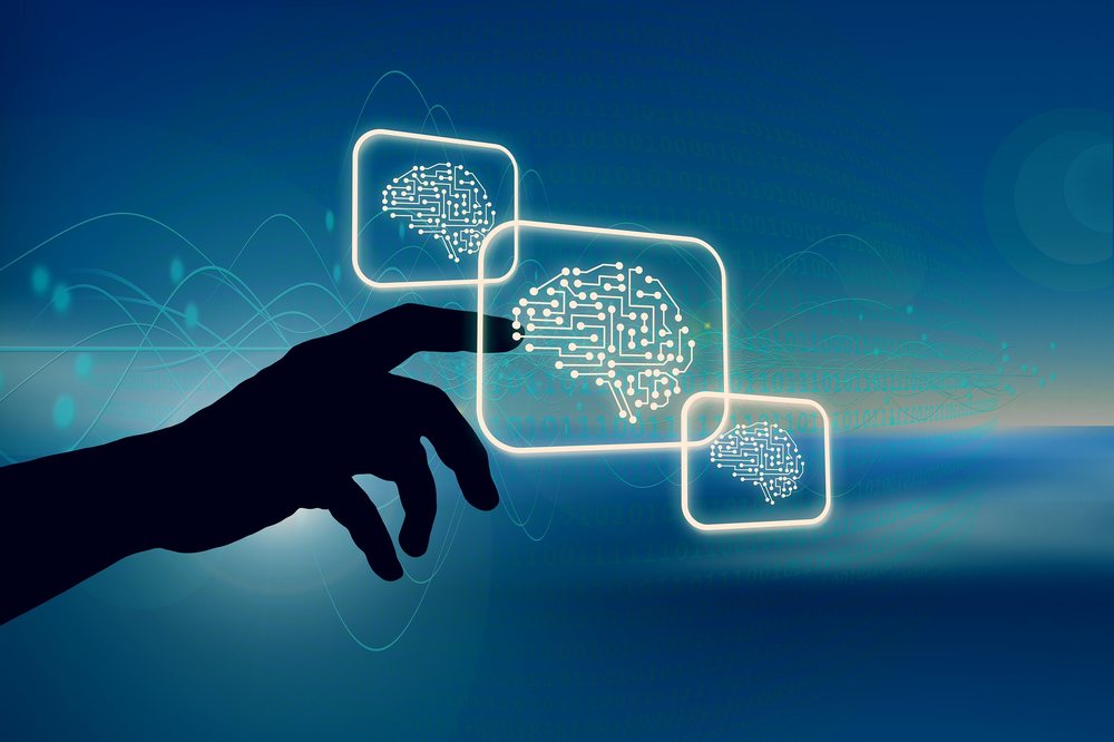 A hand engaging with AI-driven technology interfaces, representing human-led oversight of business technology